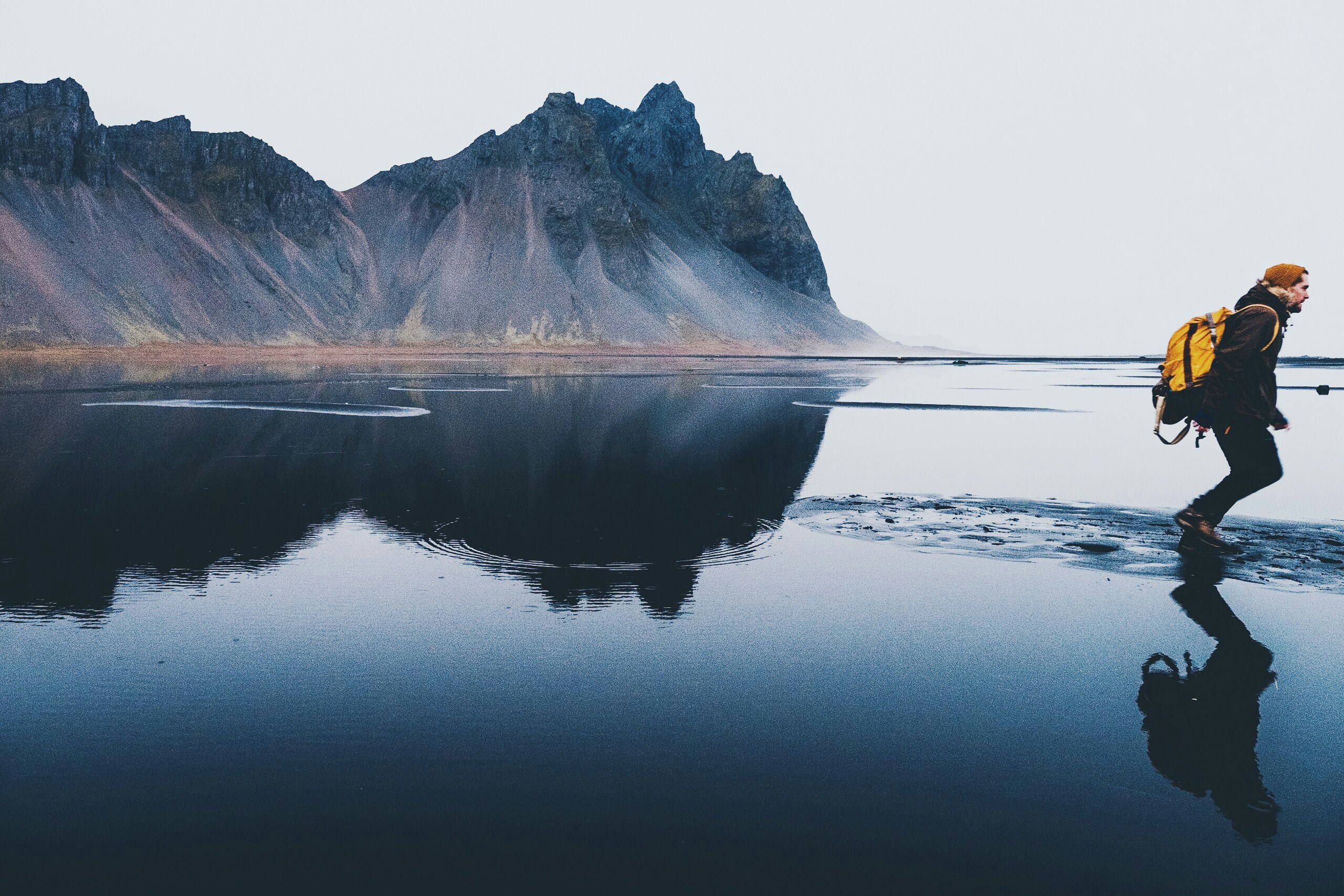 Hiker with backpack in Icelandic mountain landscape